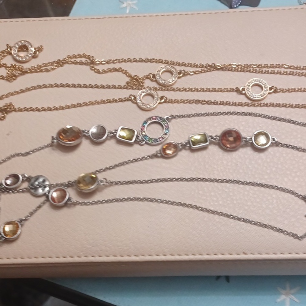 Gold and silver toned necklaces.